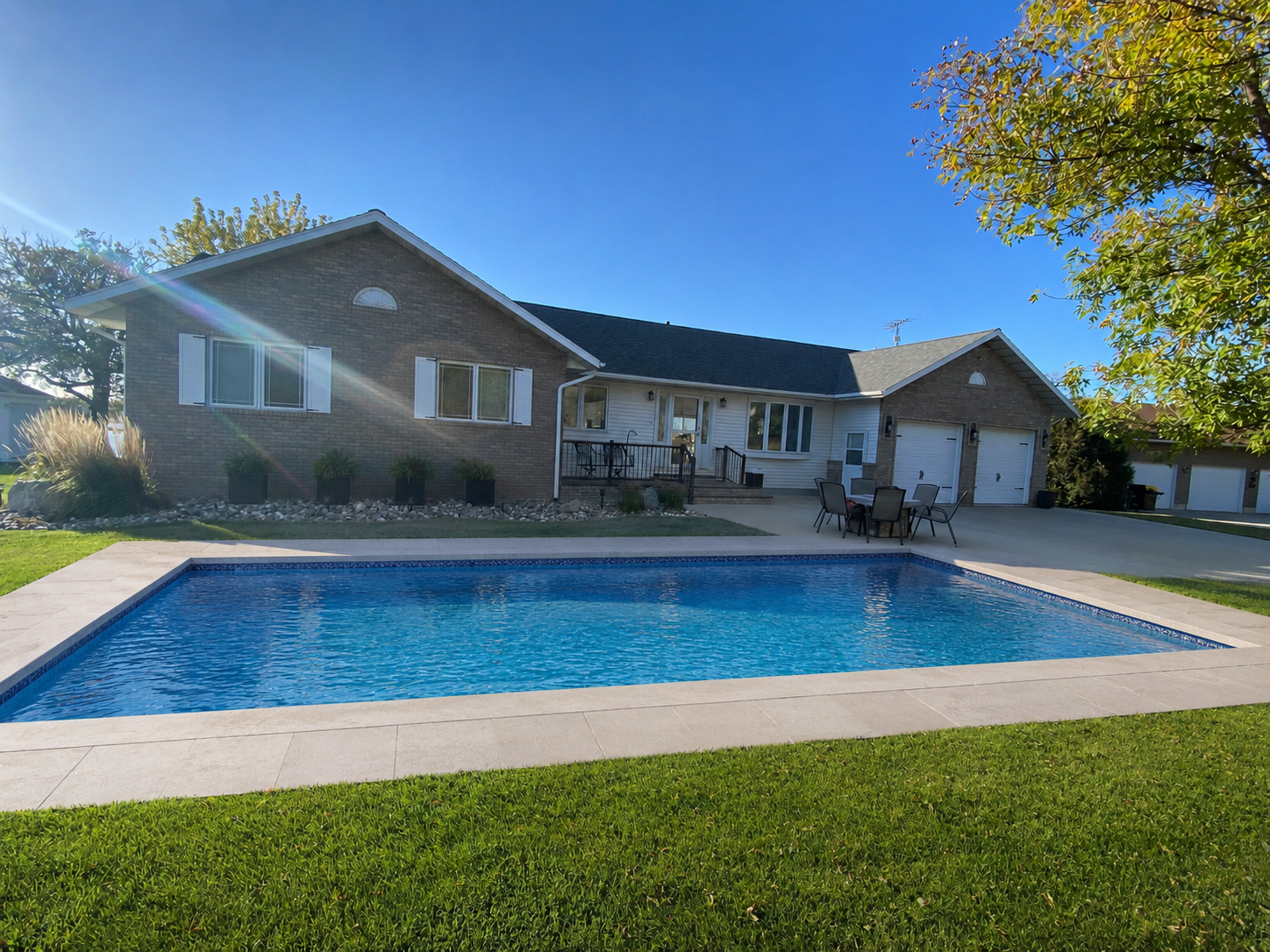 After — AI pool rendered on backyard photo