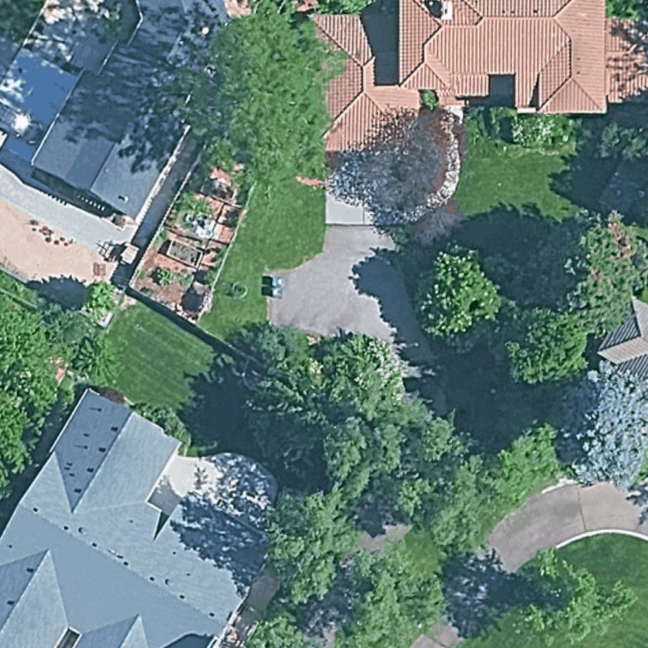 Before — satellite view of the backyard without a pool